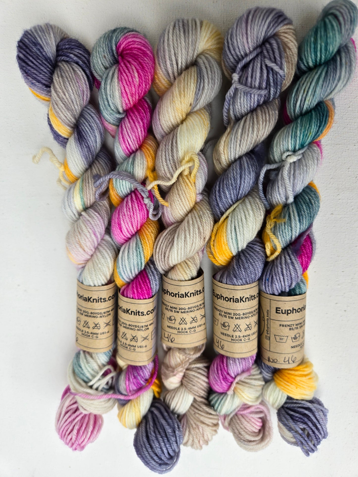Colorful yarn skeins on a white background
