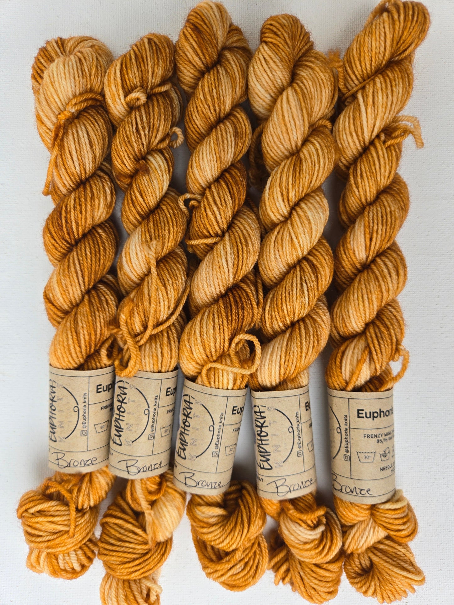 Bundles of yarn with labels on a white background